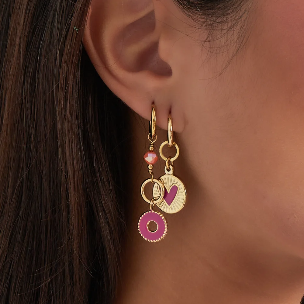 Oorbellen Mystic Mysterie goud fuchsia detail