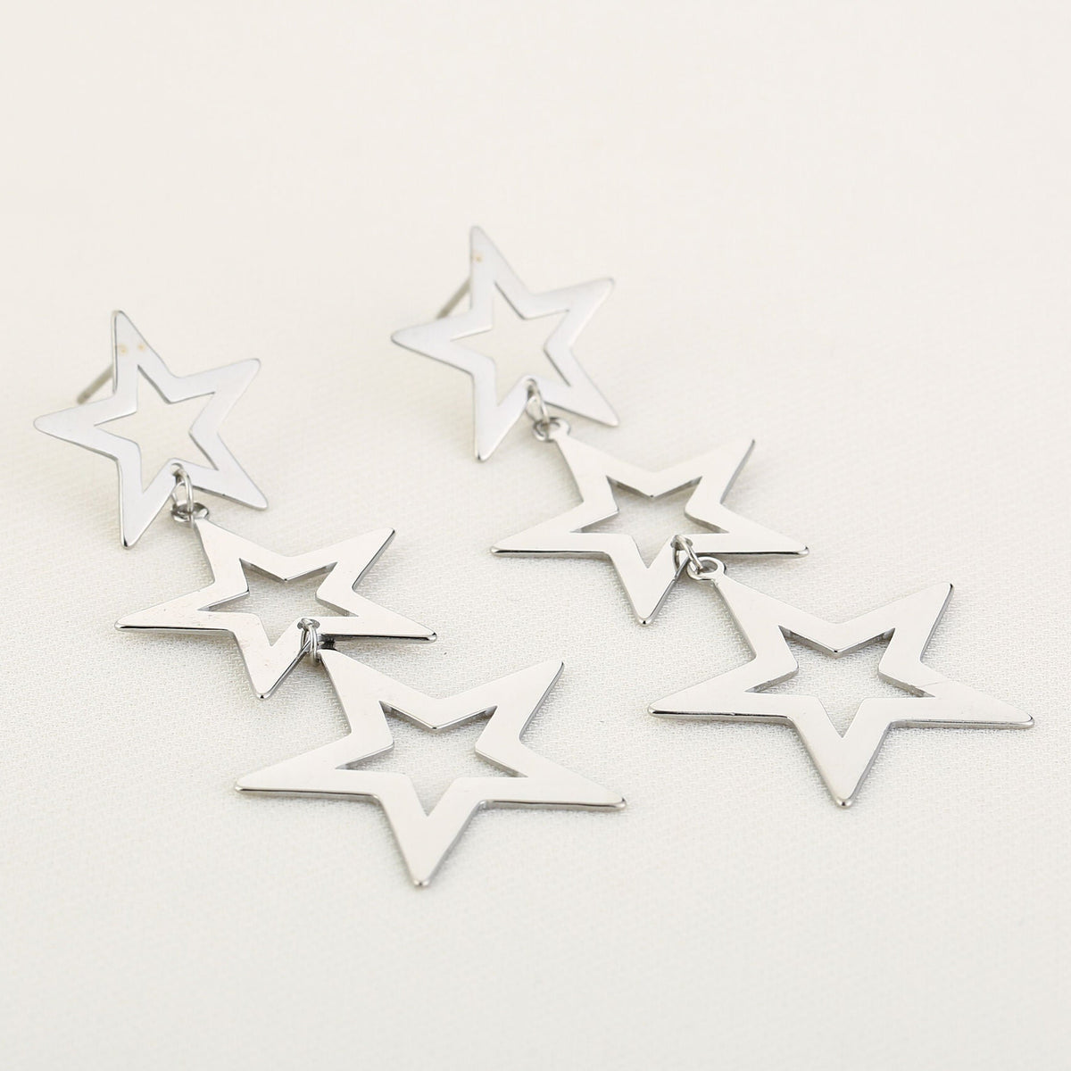 Oorbellen Triple Star zilver liggend