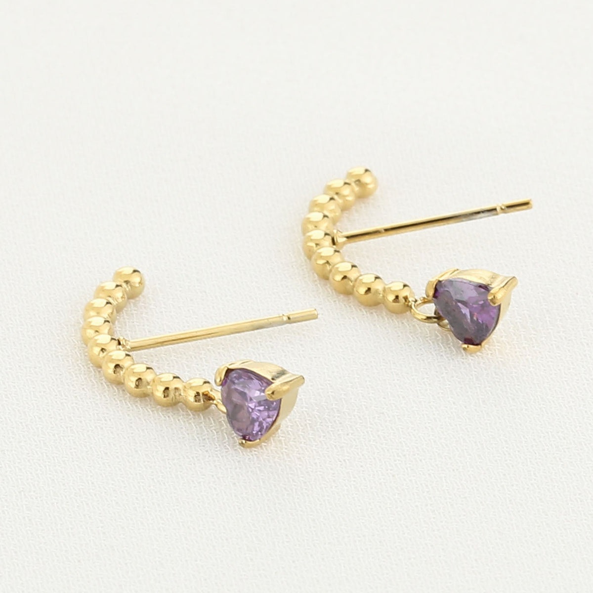 Oorbellen Zirkonia Steen goud paars liggend
