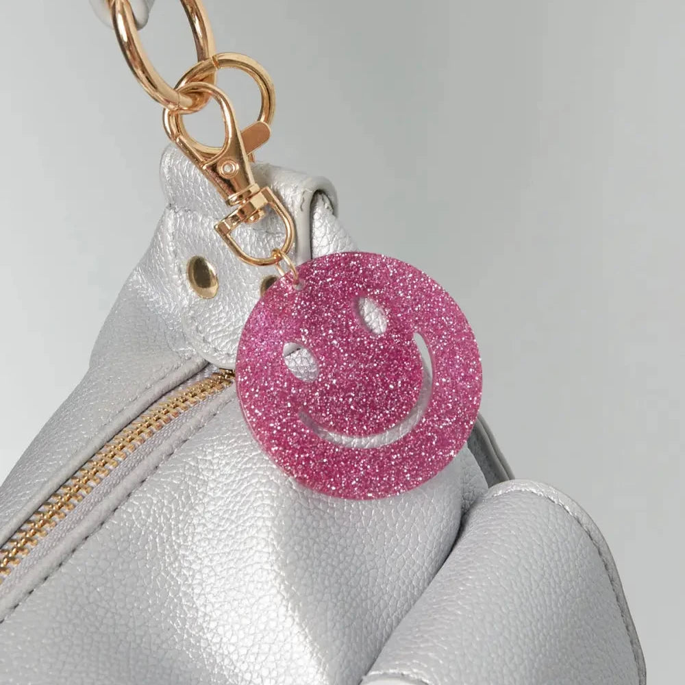 Sleutelhanger Keep Smiling goud fuchsia voorbeeld