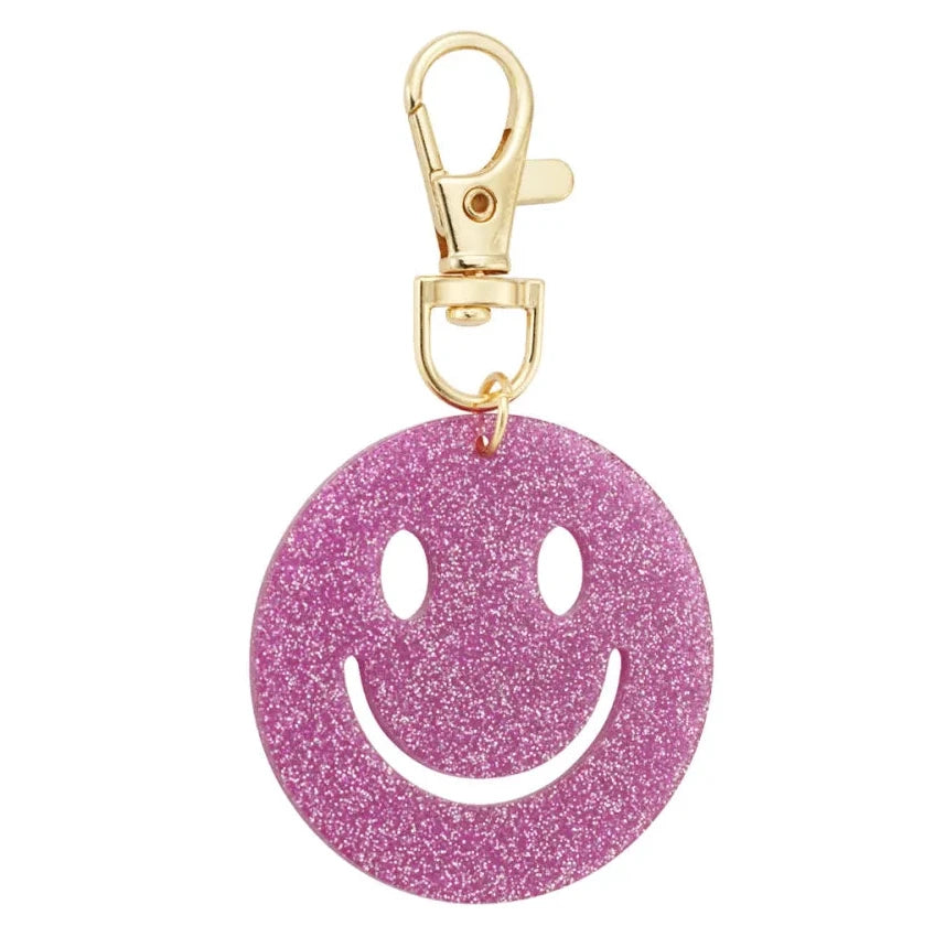 Sleutelhanger Keep Smiling goud fuchsia